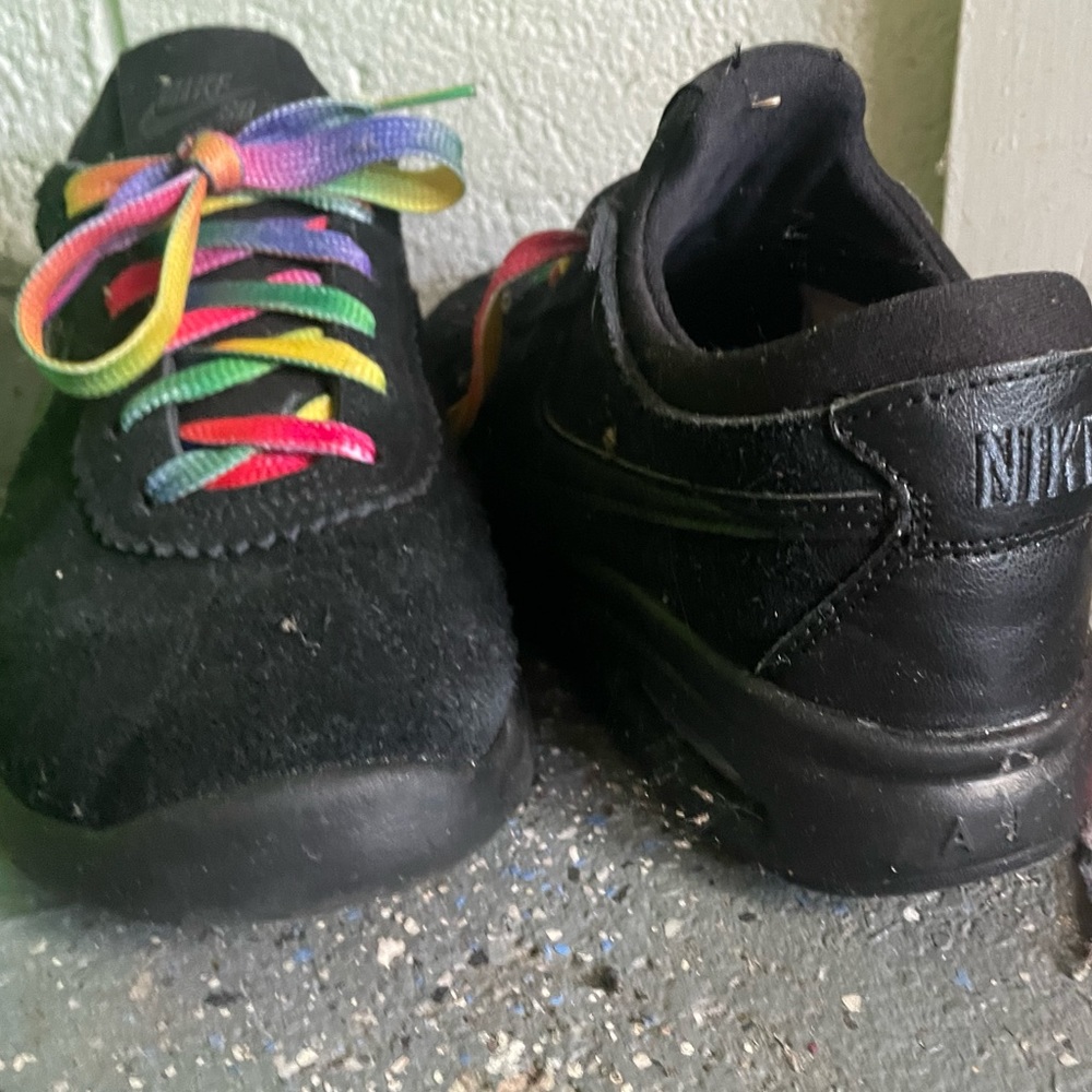 Black Nike suede shoes- w/t multi colored laces; Big kid 5 or Women’s 6.5- Used